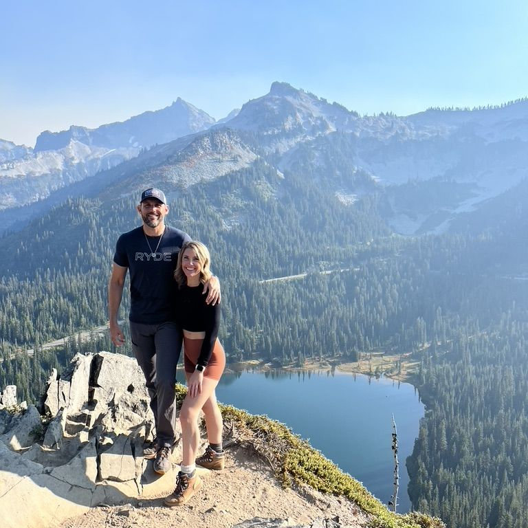 Rachelle and Clayton overlooking a mountain lake