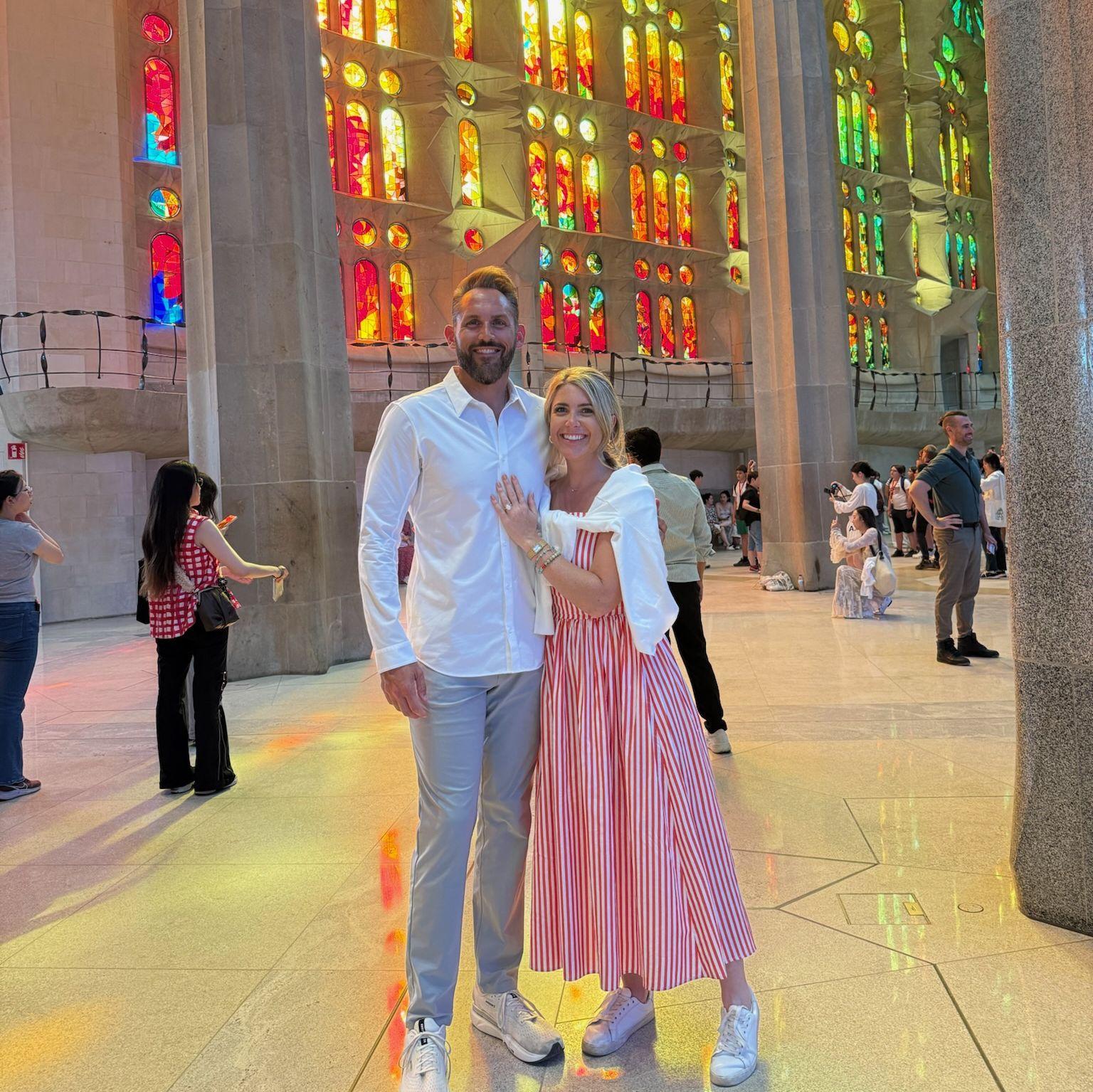 Rachelle and Clayton beneath the stained glass at the Sagrada Família